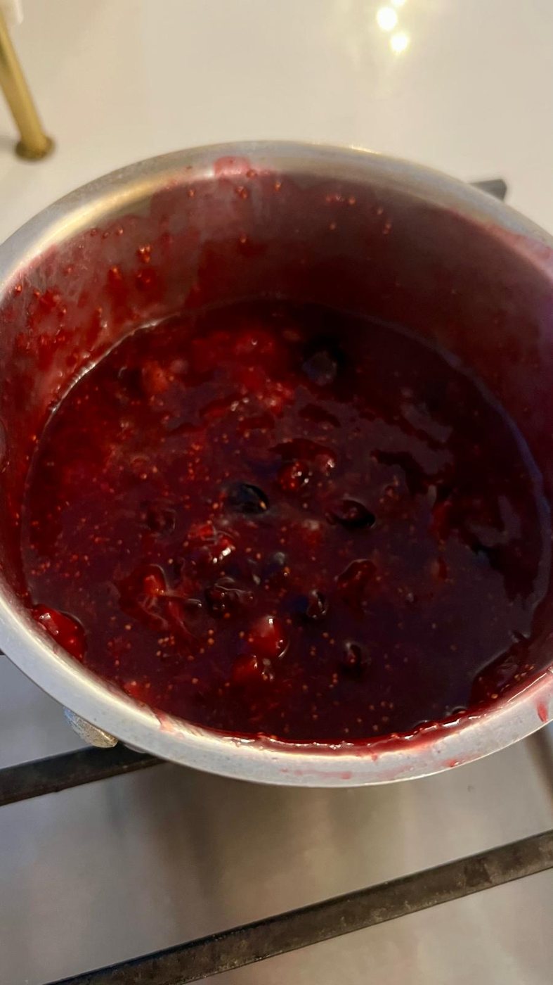 Blueberry and fig compote cooking down in the pan